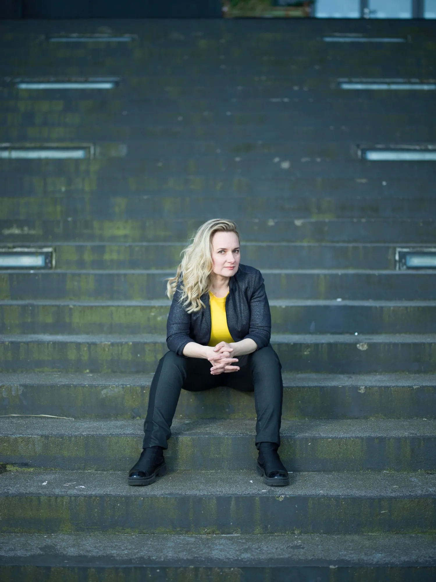 Portrait, seated on steps